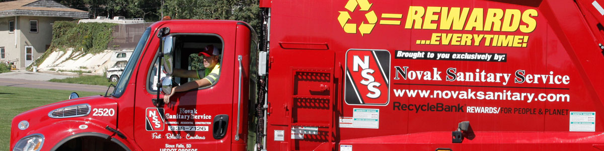 Photo of Novak Sanitary truck and driver in Harrisburg, SD.